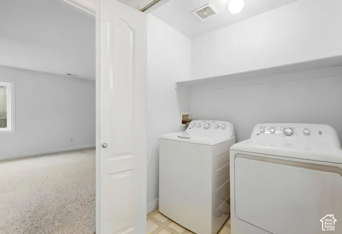 Mother in law, Built-in overhead shelving, tile flooring, and integrated ceiling lighting