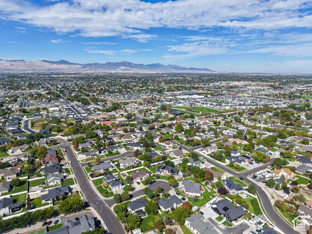 Expansive residential area featuring numerous single-family homes, mature trees, and varied architectural styles