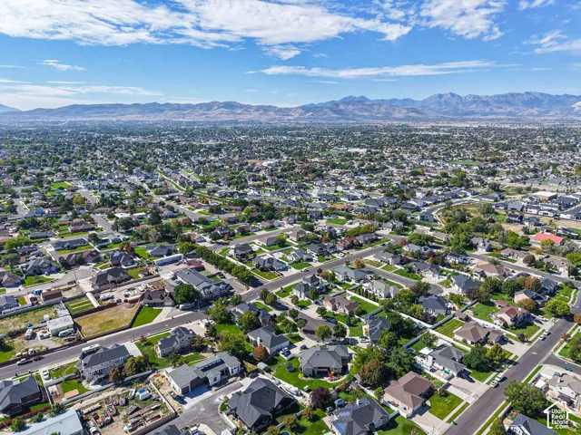 Expansive residential area featuring numerous single-family homes, mature landscaping, and an organized street grid