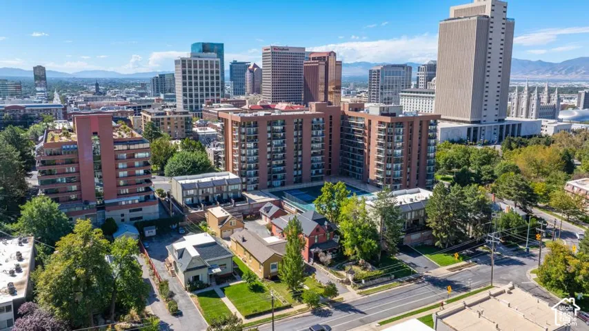 Aerial perspective showcasing urban cityscape and mountainous backdrop