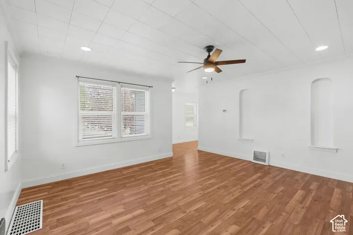 Recessed lighting, wood-finish flooring, ceiling fan, and built-in wall niches