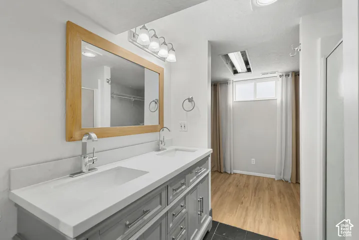Dual vanity with integrated sinks and chrome fixtures