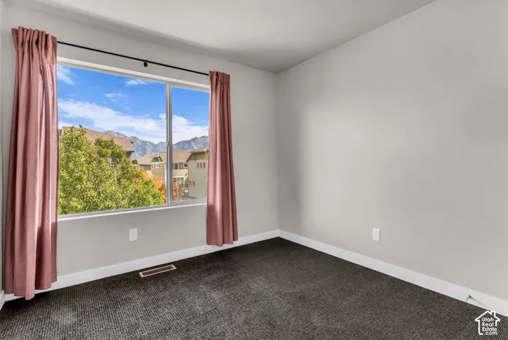 Wall-to-wall carpeting and neutral wall paint
