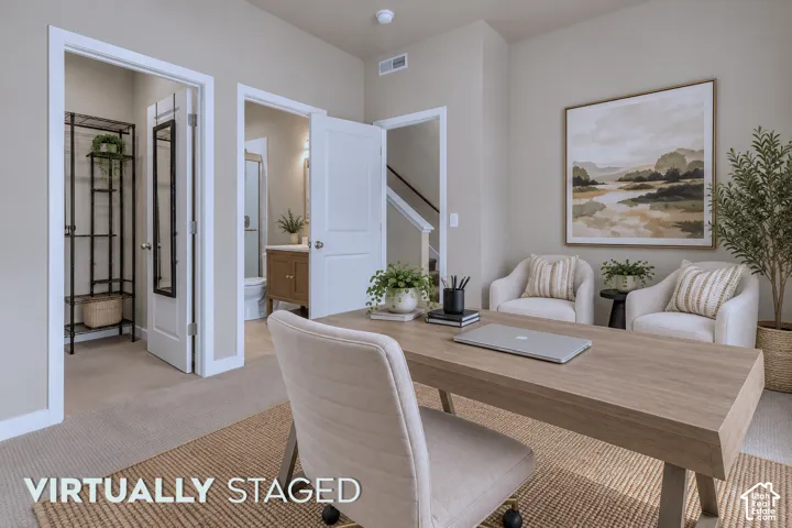 Main level space for either guest suite or office space. Virtually staged.