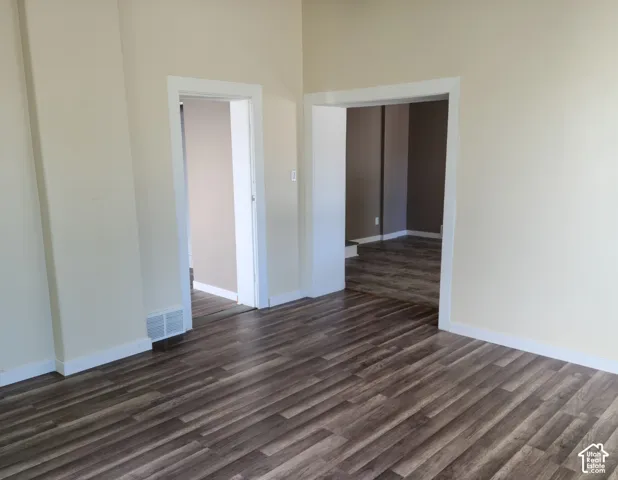 Wood-finish flooring throughout, complemented by light-toned walls and white trim
