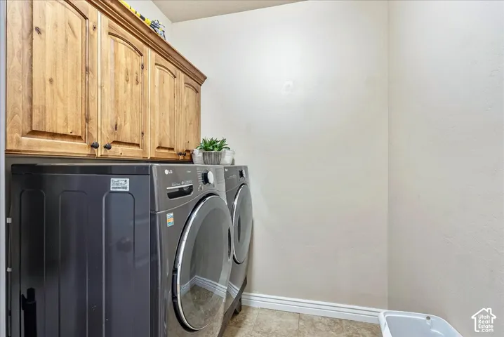 Built-in wood-finish cabinetry provides storage above appliances