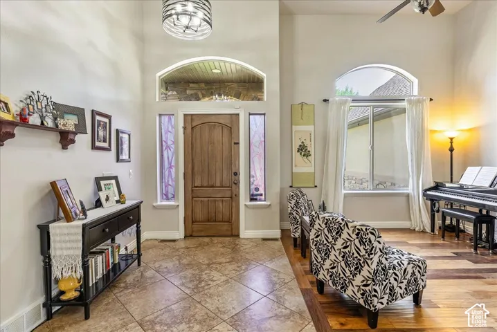 Hardwood entry door with arched transom and sidelights
