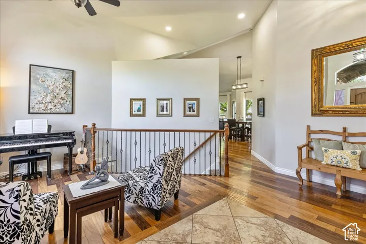 Vaulted ceiling with a ceiling fan and recessed lighting