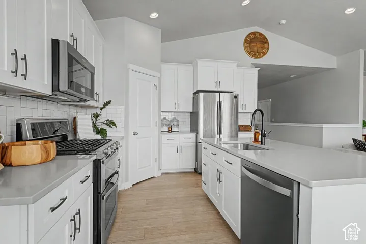 White shaker cabinetry with dark hardware