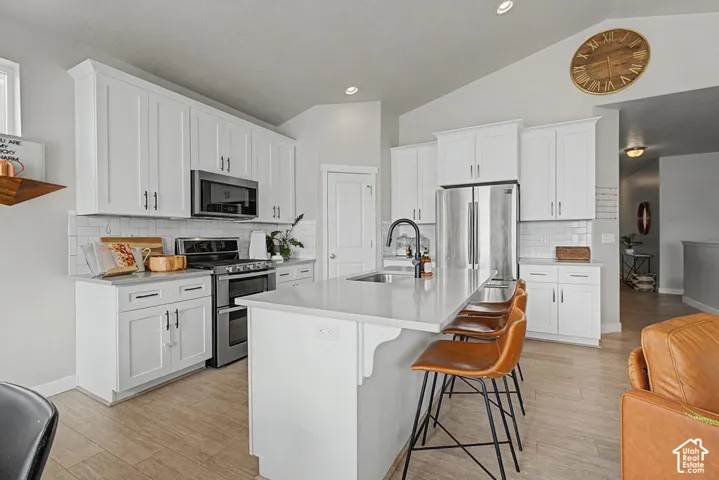 White cabinetry and stainless steel appliances
