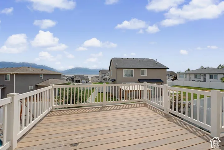 Expansive deck with composite decking and white railings