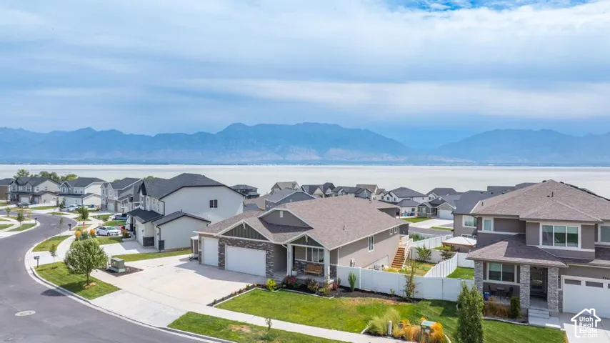 Lakeside community with mountain backdrop