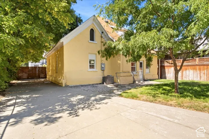 Yellow stucco exterior with a pitched roof