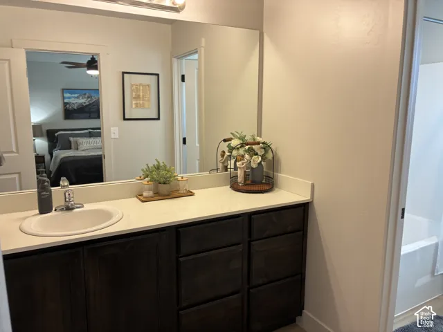 Master Bathroom with Vanity with a single basin, stainless steel faucet, and a light-colored countertop