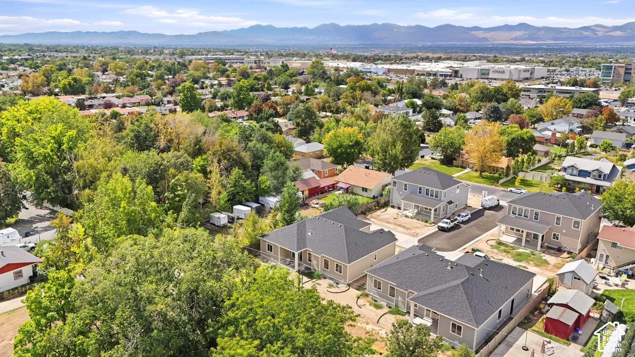 Established neighborhood setting with mature trees and visible mountain range