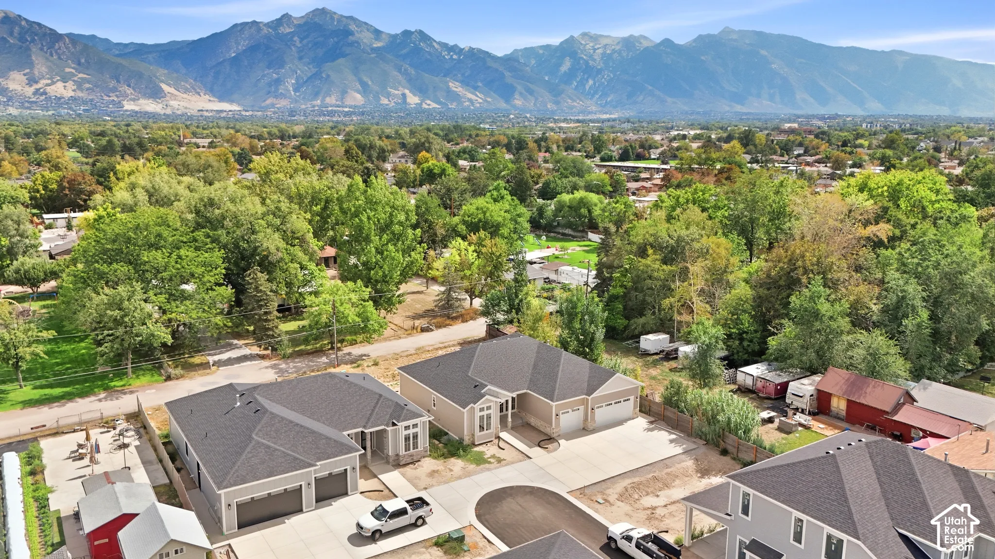 Mature trees and mountain backdrop define the area