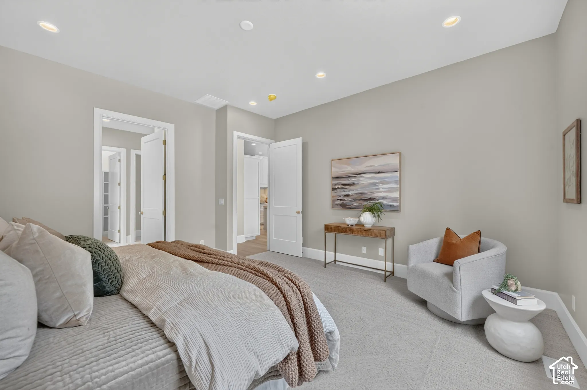 Recessed lighting, light gray wall paint, and white trim