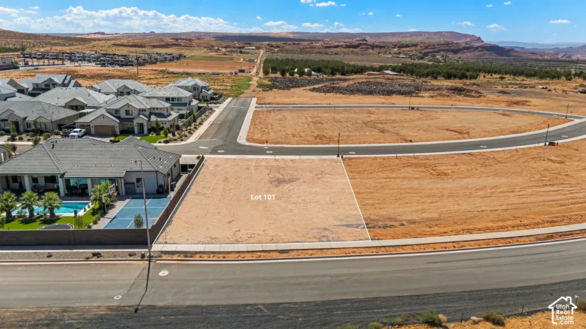 Lot 101 with clear boundary lines, street access, and surrounding developed residential properties