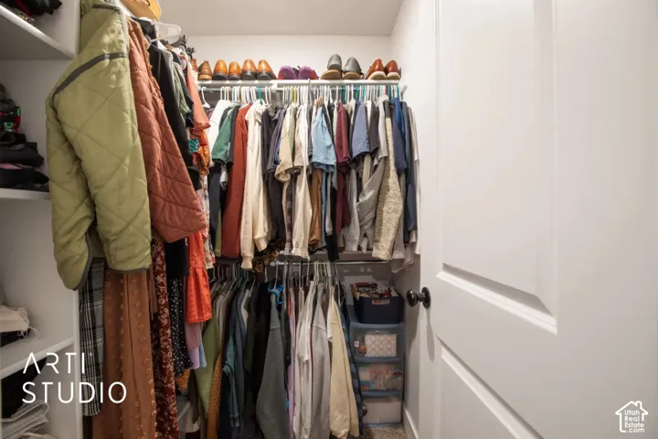 Built-in closet system with multiple shelving units and hanging rods