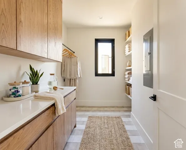 Wood-finish cabinetry and countertops provide ample storage
