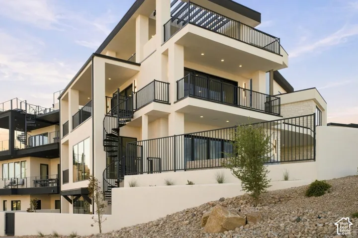 Multi-level exterior with balconies and a spiral staircase