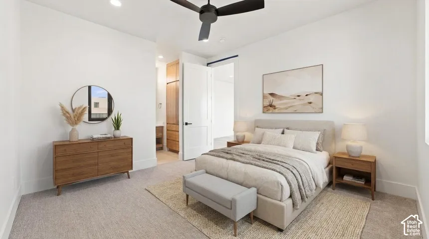 White walls, recessed lighting, and a ceiling fan create a bright atmosphere