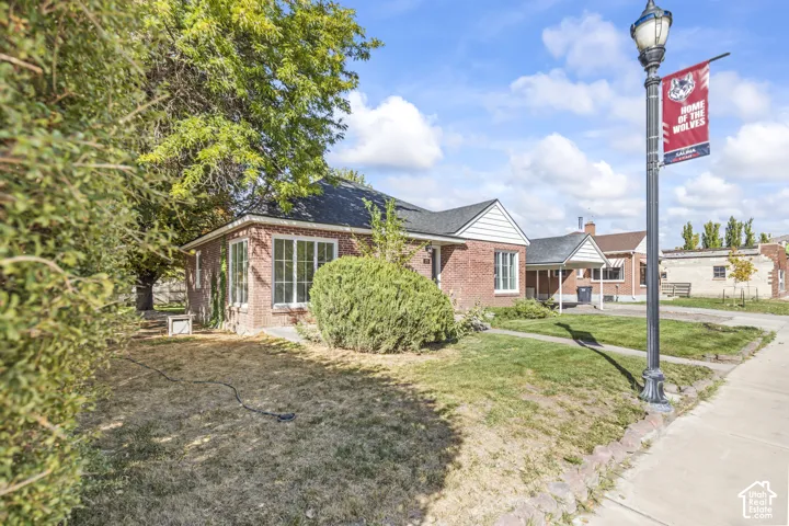 Brick exterior with a gabled roof and white trim