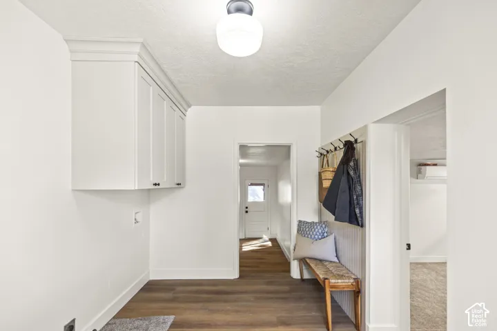 White built-in cabinetry with crown molding and black hardware