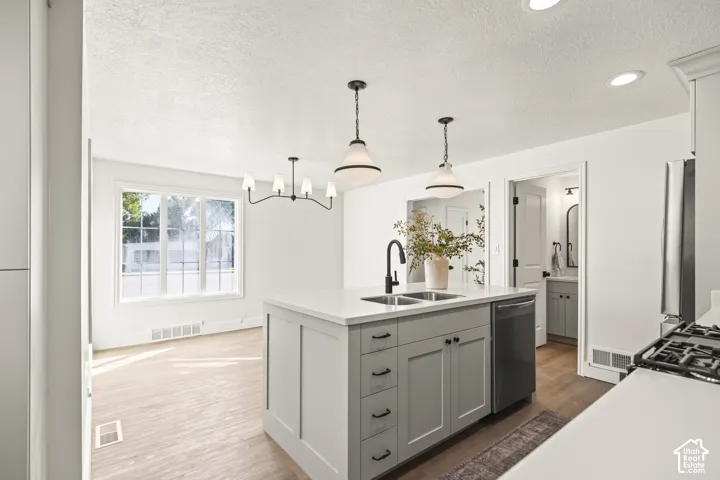 Kitchen island with an undermount double sink and matte black faucet