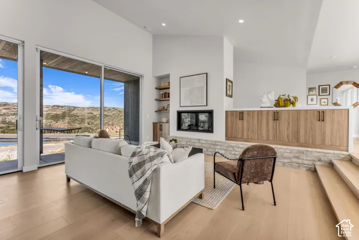 Vaulted ceilings, wood-finish flooring, and a built-in fireplace