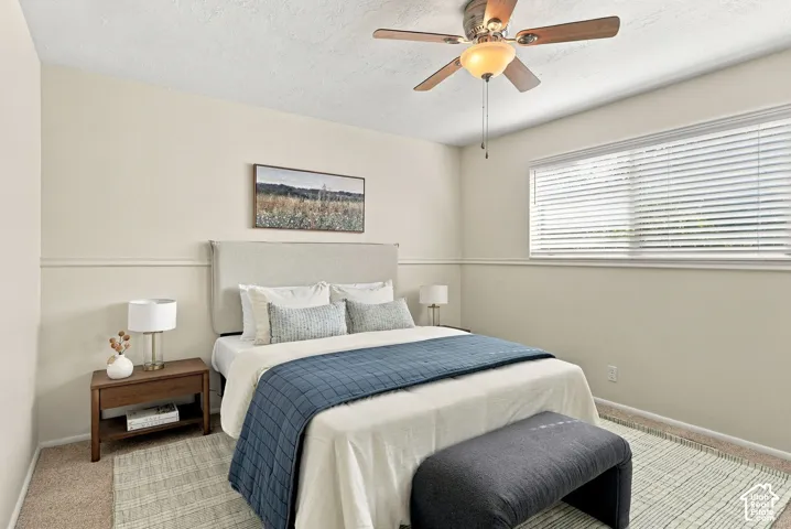 Recessed lighting, wood-finish ceiling fan, horizontal window blinds, and neutral wall paint