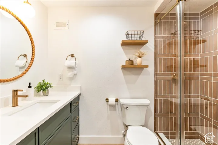 White vanity countertop with an integrated sink and brass-finish faucet
