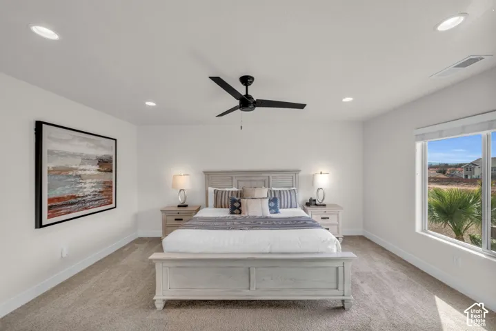 Recessed lighting, ceiling fan, and carpeted flooring