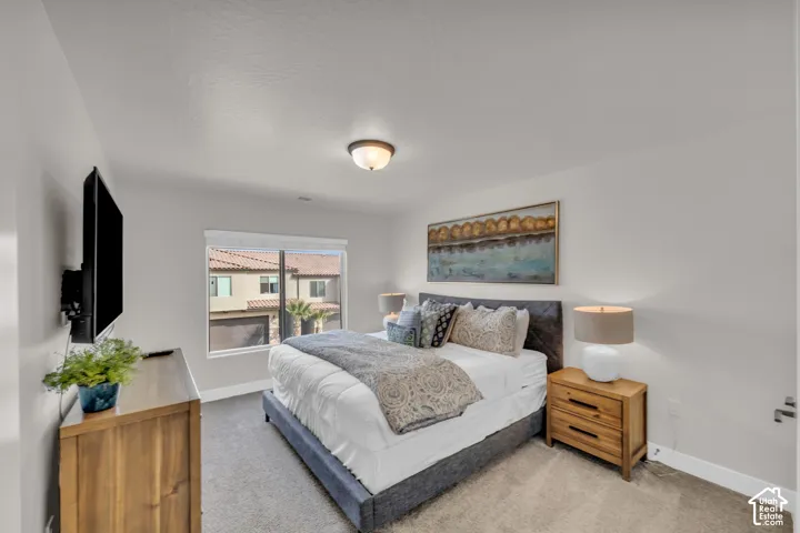 Carpeted flooring, recessed window, and flush-mount ceiling light