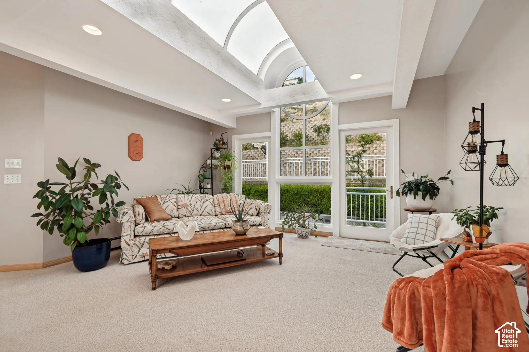 Loft at top of stairs with access to backyard balcony