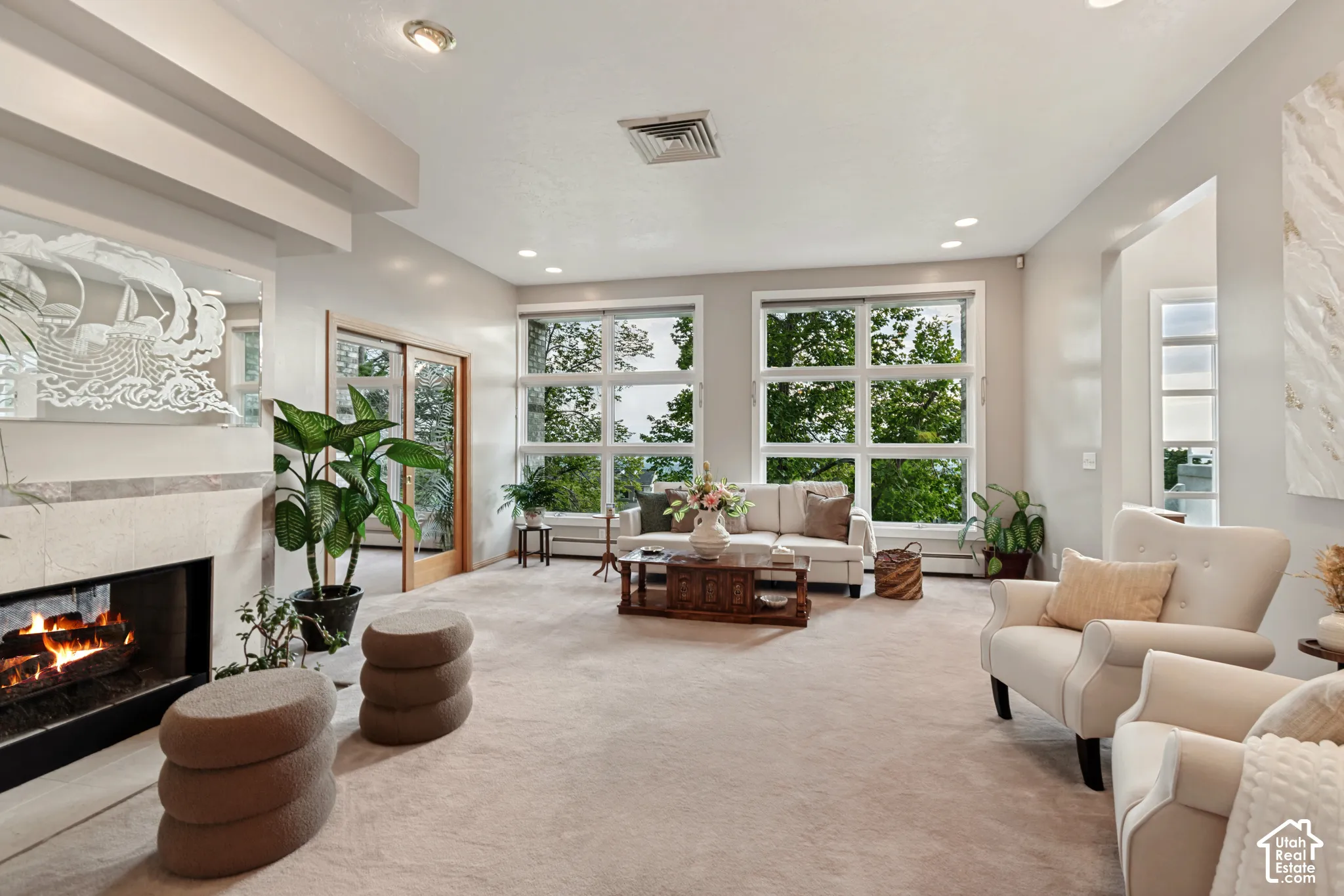 Formal living room with fireplace and valley views from windows