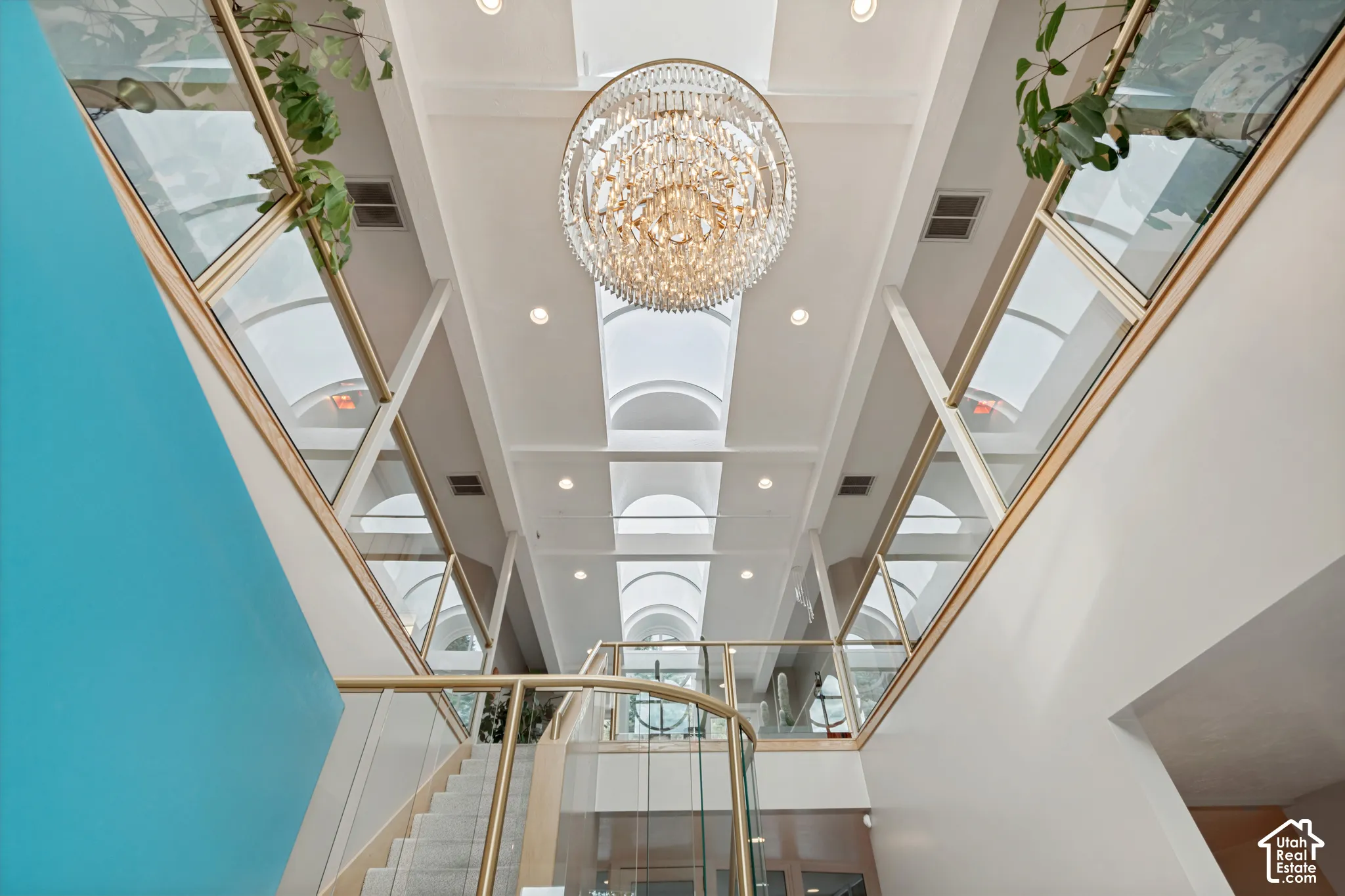 Crystal chandelier in atrium as you walk into the home