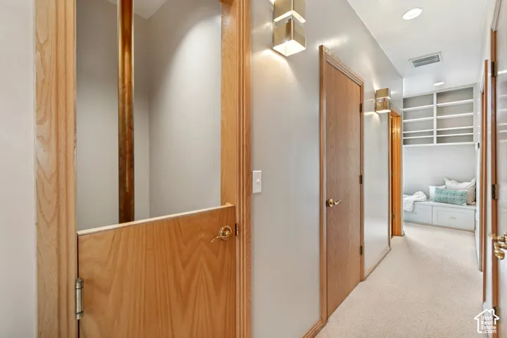 Hallway with access to original elevator shaft, currently configured as a fire pole.