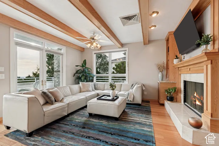 Living room with wood beams, hardwood floors &fireplace. Valley views out the windows.