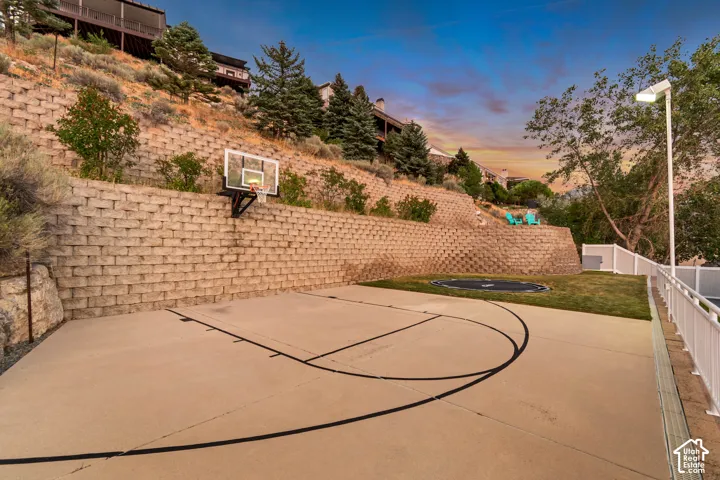 Terraced basketball court with exterior flood lights