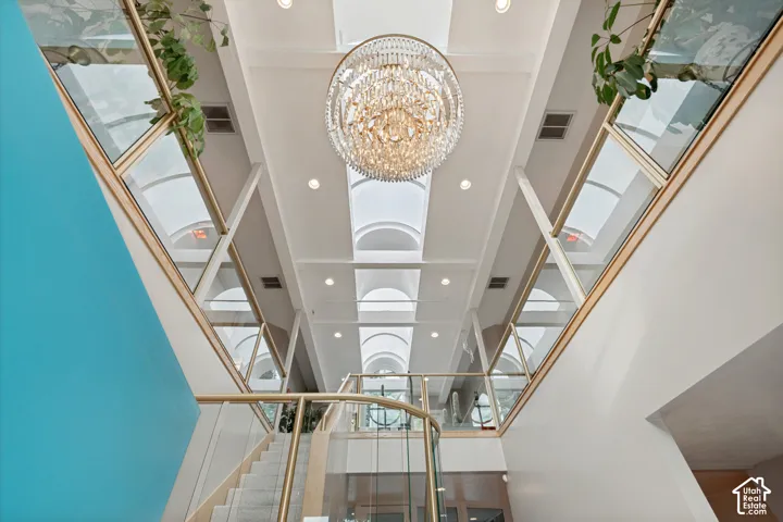 Crystal chandelier in atrium as you walk into the home
