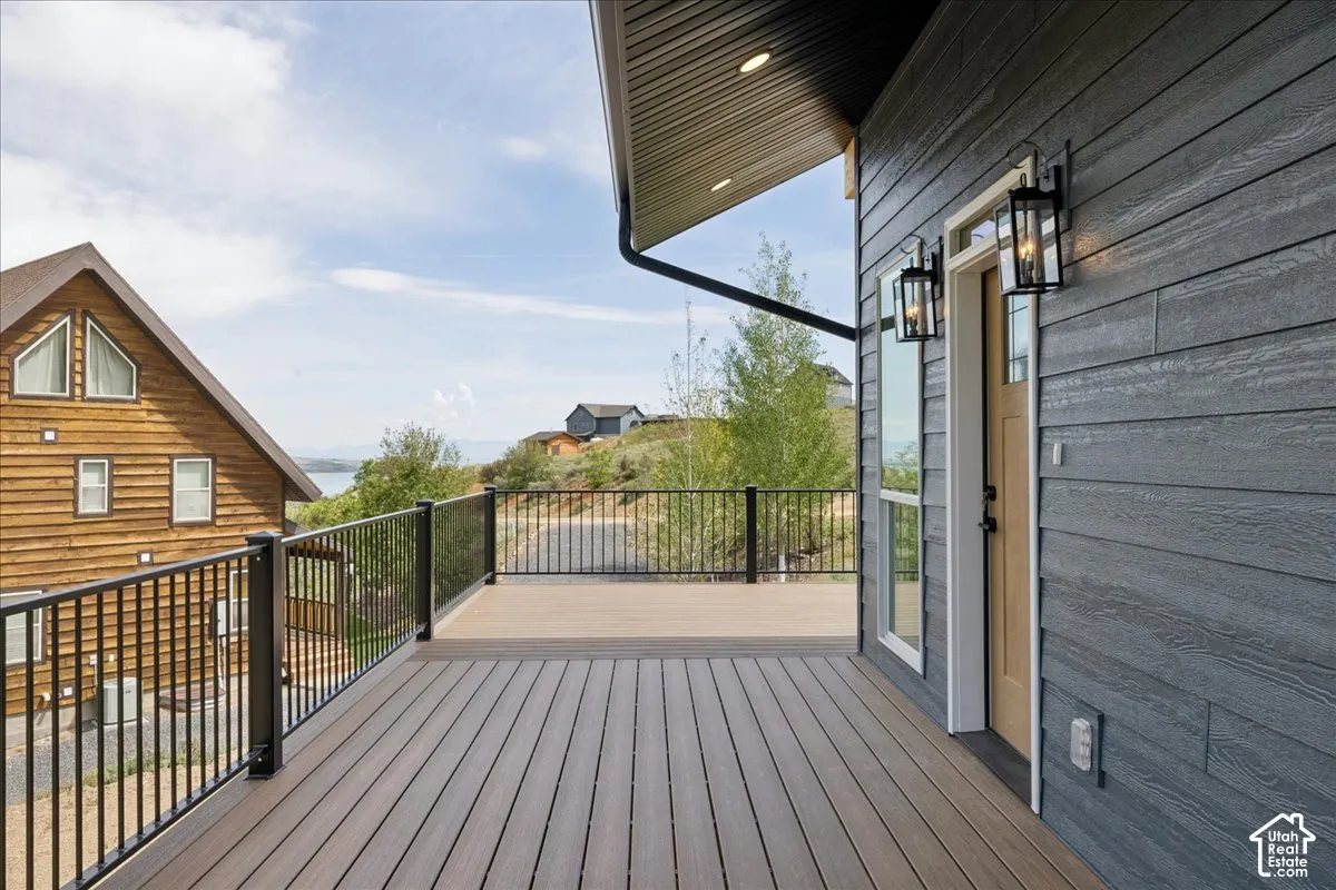 Expansive deck with composite decking and black metal railings