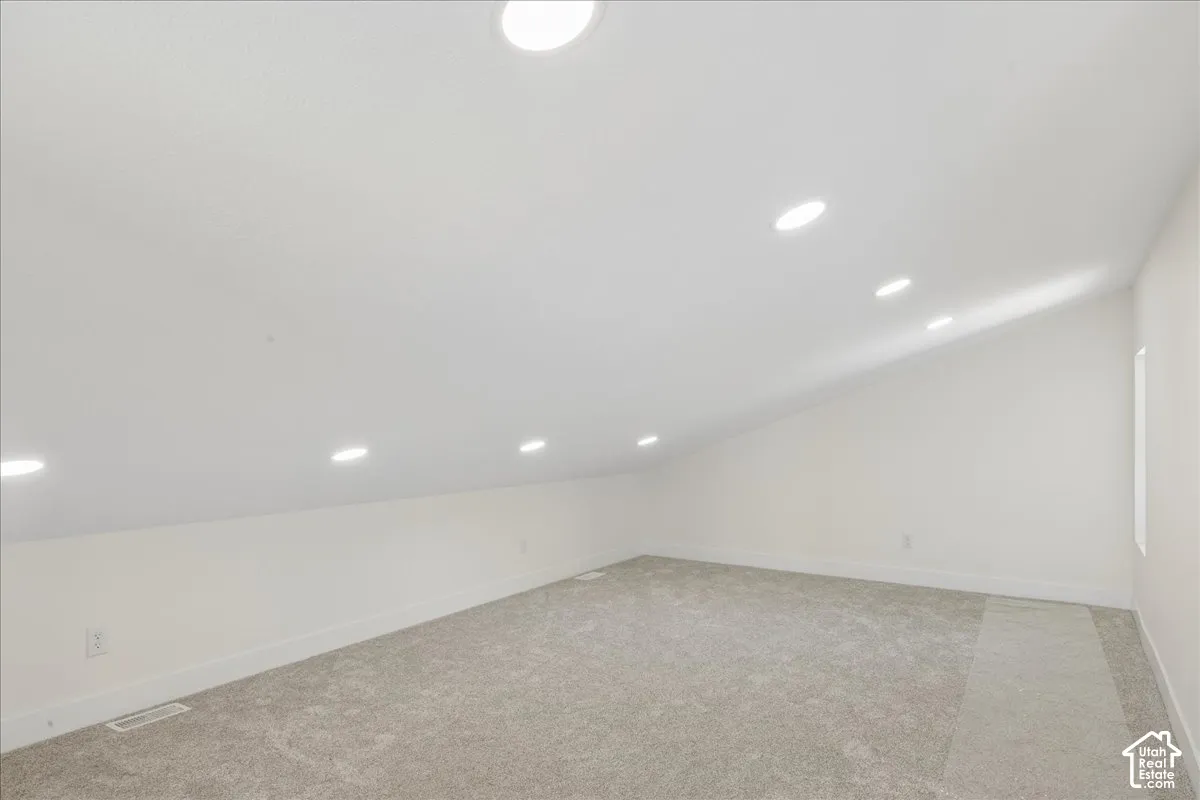 Bonus room above garage. Sloped ceiling with recessed lighting.