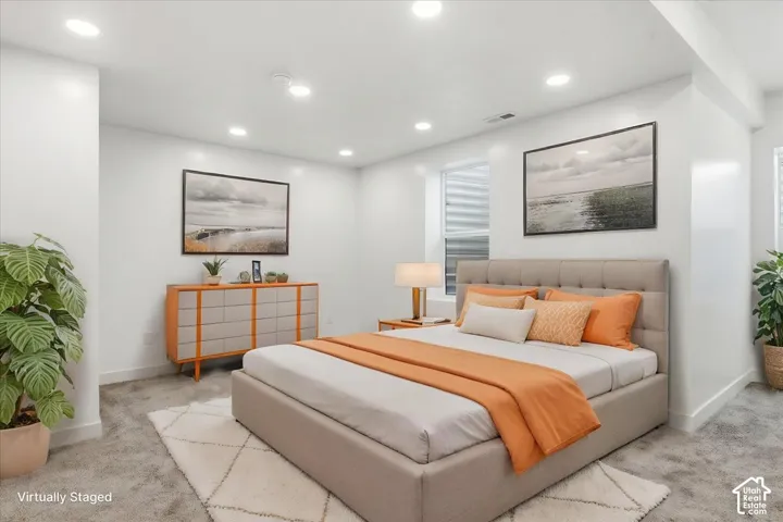 Primary Bedroom. Recessed lighting illuminates this room featuring wall-to-wall carpeting and a window