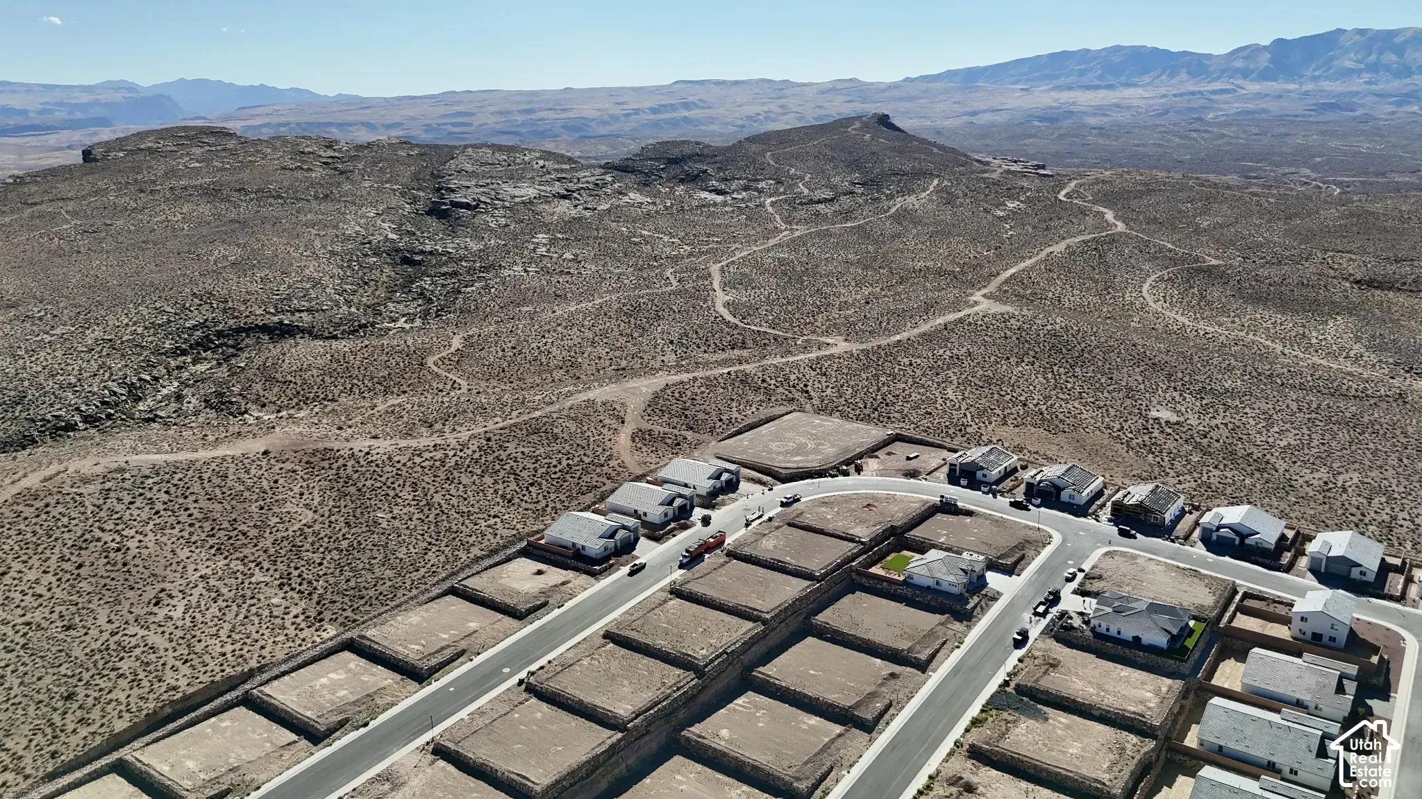 New construction residences with paved roads and graded lots