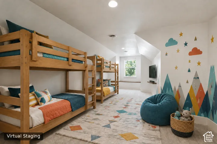 Recessed lighting, wood-finish flooring, a wall-mounted shelving unit, and a window with a built-in bench