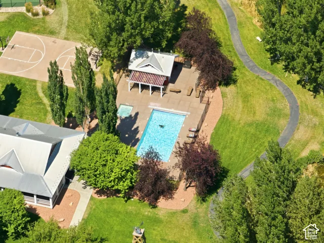 Community amenities featuring a swimming pool, hot tub, covered pergola, basketball court, and walking paths