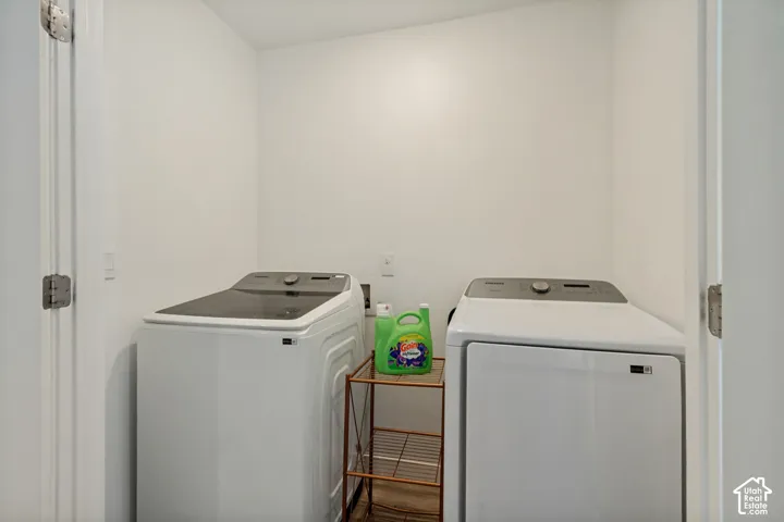 Dedicated laundry area with white walls
