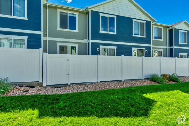 Private white fence with gated access