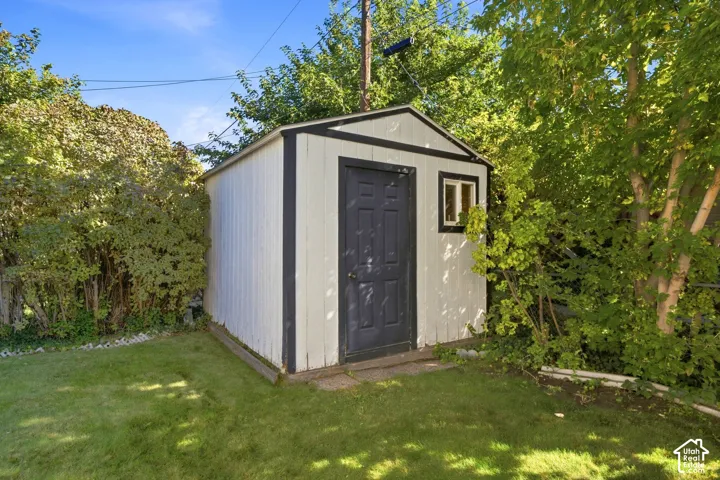 Storage shed with a single door, one window, and a gabled roof